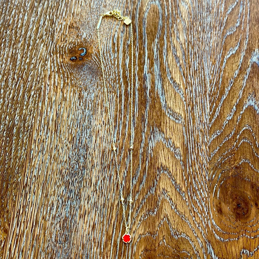 Kendra Scott “Nola” gold necklace with red stone